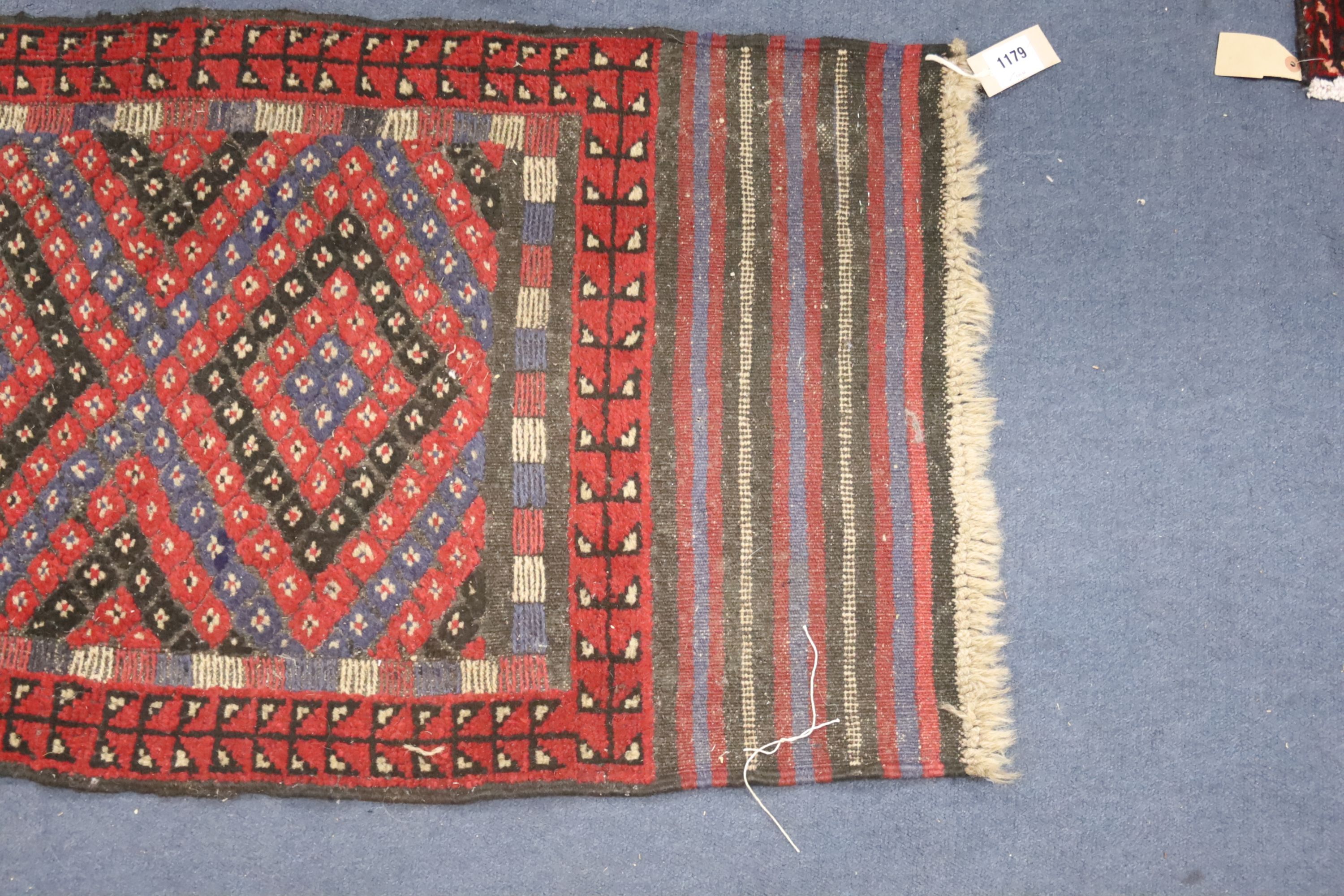 A Kelim polychrome geometric runner, 240 x 59cm